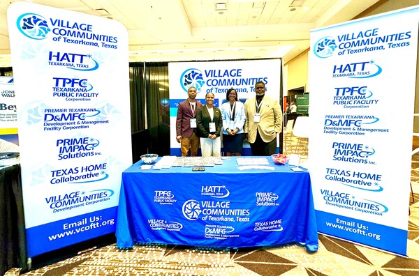 A group of people posing at the VCTT Booth.